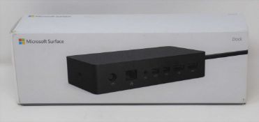 A boxed as new Microsoft Surface Dock PF3-00012 (Box sealed, some damage to box).