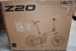 A Himo Z20 electric folding bike (Requires UK plug adaptor).