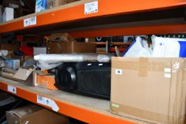 One shelf of miscellaneous items to include pre-owned Sony speakers and Reverb Clip-On tuners.