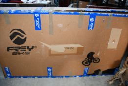 A boxed Frey EX electric bike.