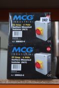Four boxed MCG industrial service mounted isolators (AC1).