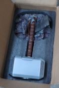 An as new life size replica Mjölnir Thor hammer with base.