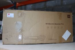 A pre-owned boxed Mi Pro electric scooter (Item may be incomplete).