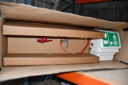 A boxed as new commercial emergency eyewash station.