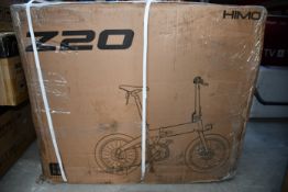 A boxed HIMO Z20 folding electric bike in grey.
