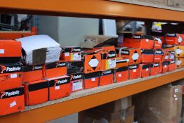 A large quantity of Paslode nails and related items.