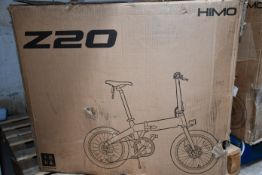 A boxed Himo Z20 Electric folding bike in grey.