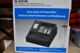 A boxed as new Sharp XE - A137 - BK electronic cash register (Damage to outer box).