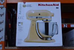 A boxed as new 4.8 L KitchenAid Artisan mixer in majestic yellow.
