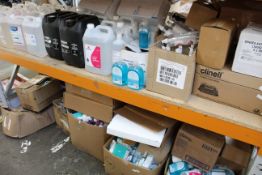 Two shelves of assorted hand sanitizers/soaps and related items.