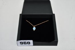 A boxed WWake (Medium sized) opal and sapphire pendant necklace with 16