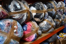 Ten bags of assorted clothing and related items.