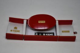 A boxed as new Supreme Kent Military Hairbrush in Red