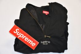 An as new Supreme track half zip pullover (SS20) in black (L).