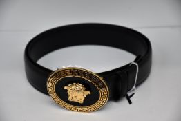 An as new Versace oval medallion leather belt (Size 90 - RRP £350).