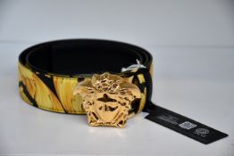 An as new Versace Gold Hibiscus print Plazzo belt (Size 95 - RRP £370).