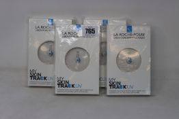 Four boxed as new La Roche-Posay My Skin Track UV wearable sensors.