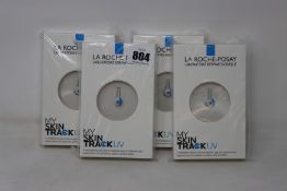 Four boxed as new La Roche-Posay My Skin Track UV wearable sensors.