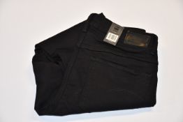 Four pairs of as new G-Star Raw jeans (All W32/L30).