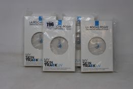 Four boxed as new La Roche-Posay My Skin Track UV wearable sensors.