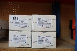 Four boxed Dormakaba TS83 Size 3-6 overhead door closers.