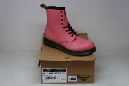 A pair of as new Dr Martens 1460 boots in acid pink (UK 5).