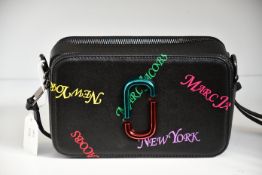 An as new Marc Jacobs camera bag in black.
