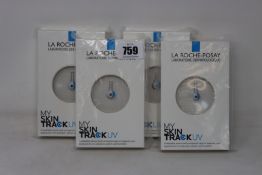 Four boxed as new La Roche-Posay My Skin Track UV wearable sensors.