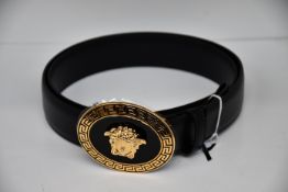 An as new Versace oval medallion leather belt (Size 95 - RRP £350).
