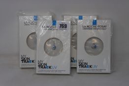 Four boxed as new La Roche-Posay My Skin Track UV wearable sensors.