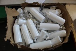 A large quantity of soap dispenser bottles in a white and silver finish.