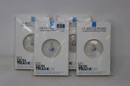 Four boxed as new La Roche-Posay My Skin Track UV wearable sensors.