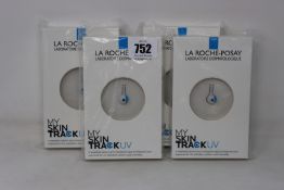 Four boxed as new La Roche-Posay My Skin Track UV wearable sensors.