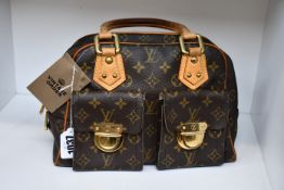A pre-owned vintage Louis Vuitton handbag (Good condition).