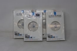 Four boxed as new La Roche-Posay My Skin Track UV wearable sensors.