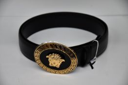 An as new Versace oval medallion leather belt (Size 105 - RRP £350).