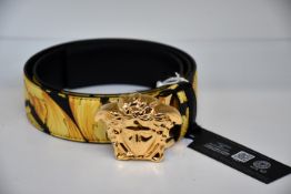 An as new Versace Gold Hibiscus print Plazzo belt (Size 90 - RRP £370).