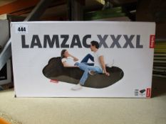 A boxed Fatboy Lamzac XXXL inflatable lounger in Toupe.