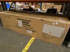 A boxed Yamaha Arius YDP-144 Digital Piano.