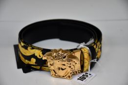 An as new Versace Gold Hibiscus print Plazzo belt (Size 100 - RRP £370).