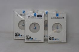 Four boxed as new La Roche-Posay My Skin Track UV wearable sensors.