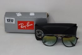A pair of as new Ray Ban sunglasses.