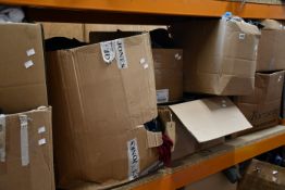 Eight boxes of assorted clothing and related items.