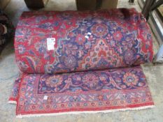 A pre-owned handmade Persian carpet (390x294cm).