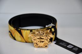 An as new Versace Gold Hibiscus print Plazzo belt (Size 105 - RRP £370).