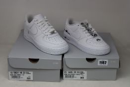 Two pairs of as new Nike trainers; Air Force 1 07 (UK 5) and youths Air Force 1 LV8 (UK 3).