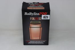 A boxed Babyliss PRO FoilFX02 double foil shaver (May require UK adaptor, some attachments may be