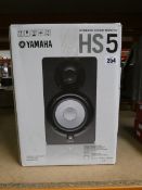 A boxed Yamaha HS5 powered studio monitor in black.