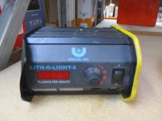 A pre-owned Unilux Lith-O-Light 5 strobe light (Some damage to chassis, power lead required).