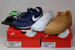Three pairs of as new Nike trainers; Court Vision (UK 9), MD Runner 2 (UK 10) and Renew Element